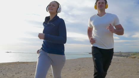 Couple-Jogging-on-the-Beach