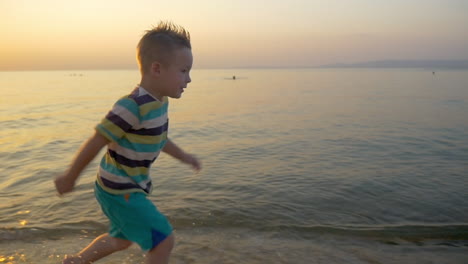 Smiling-Boy-Running-along-the-Sea