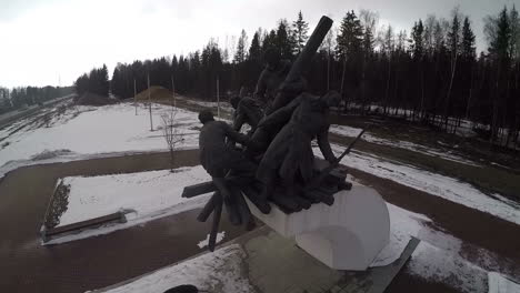 Flying-over-the-war-memorial-by-the-road