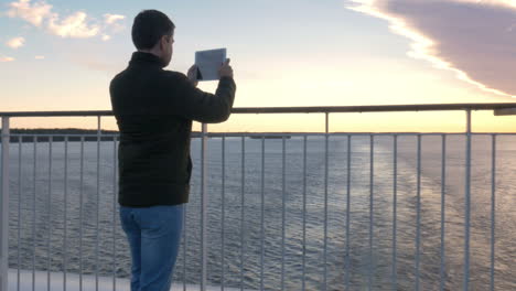 Adult-Man-With-Tablet-On-Cruise-Ship