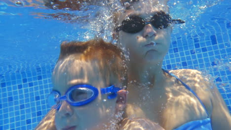 Woman-and-Boy-Holding-Breath-Under-Water