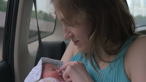 Mother-with-Newborn-Baby-in-Car