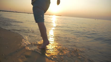 Feet-of-Boy-Running-on-the-Beach