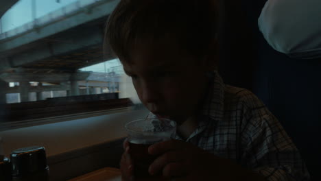 Little-Boy-Traveling-by-Train