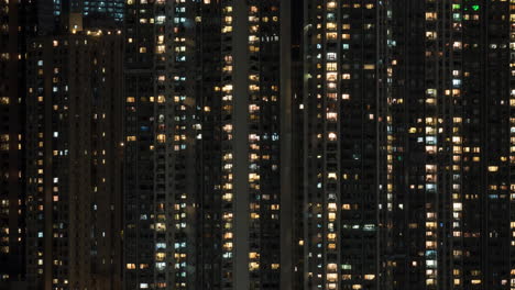 Timelapse-of-window-lights-in-high-rise-apartment-block-at-night