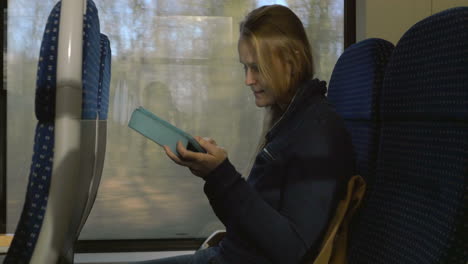 Woman-with-Tablet-PC-on-Train