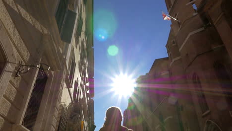 Woman-in-Via-del-Babuino-street-on-sunny-day