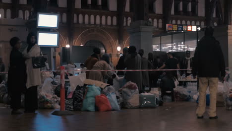 Female-Syrian-Refugees-Taking-Donated-Clothes-at-Charity-Collecting-Point-in-Copenhagen-Railroad-Station