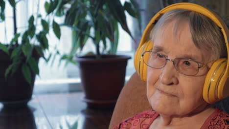 Senior-Woman-Listening-to-the-Music-in-Headphones