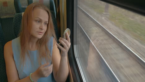 Woman-with-Pocket-Glass-in-Train