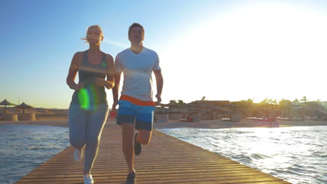 Couple-Jogging-on-the-Sea-Pier
