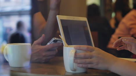 Gadgets-and-Cups-on-the-Cafe-Table