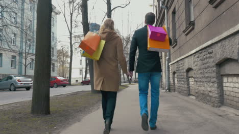 Couple-enjoying-the-walk-after-good-shopping