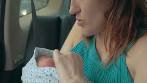 Mother-with-baby-travelling-by-car