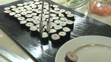 Sushi-Rolls-Served-On-Plate-In-Japanese-Restaurant