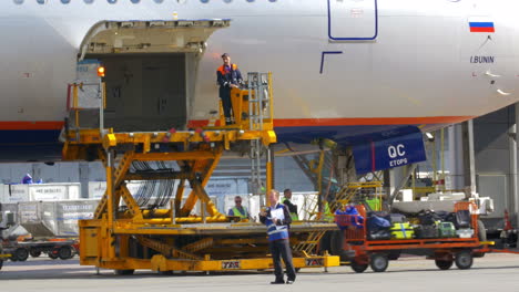People-Unloading-Baggage-Hold-of-the-Plane