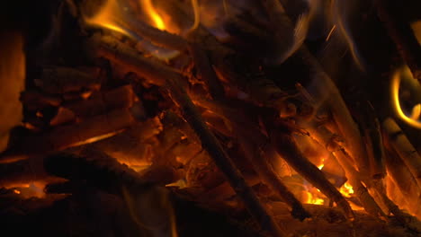Wooden-Sticks-on-Fire-and-Ash-in-the-Fireplace