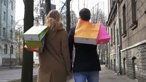 Young-Couple-With-Shopping-Bags
