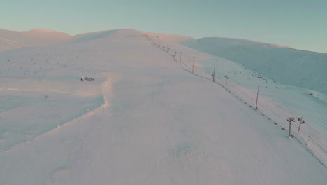Aerial-shot-of-empty-ski-run-and-lift
