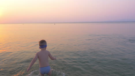 Child-running-to-bathe-in-the-sea