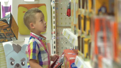 Boy-Choosing-Toys-in-the-Shop