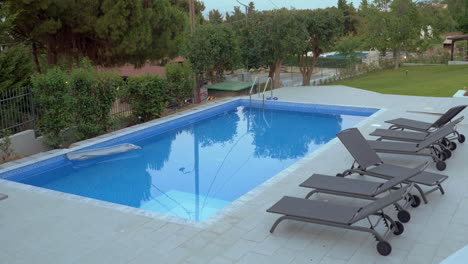 Cinemagraph---outdoor-pool-with-empty-chaise-longues