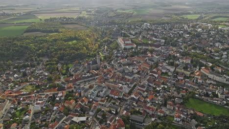 Kutna-Hora-Czechia-Aerial-v4-high-altitude-birds-eye-view-drone-flyover-Hlouska-capturing-picturesque-townscape-of-hillside-town-center-from-above---Shot-with-Mavic-3-Cine---November-2022