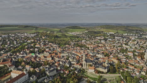 Kutna-Hora-Czechia-Aerial-v12-high-attitude-drone-flyover-hillside-town-center-capturing-panoramic-view-of-beautiful-townscape-featuring-landmark-Italian-court---Shot-with-Mavic-3-Cine---November-2022