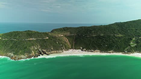 Aerial-of-beach-paradise-with-soft-sand-near-Rio-de-Janeiro-in-Brazil,-South-America