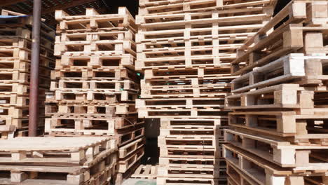 Stacked-wooden-pallets-in-a-warehouse-yard