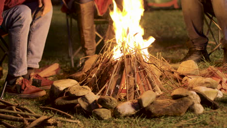 Handheld-footage-of-man-making-camp-fire-for-his-friends-in-a-cold-night