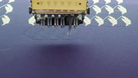 Dolly-shot-of-modern-sewing-machine-doing-digital-pattern