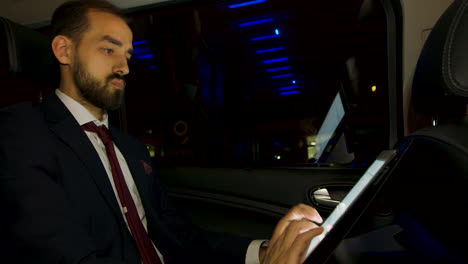 CEO-thinking-about-his-next-business-move-in-the-back-seat-of-his-luxury-car-with-personal-driver