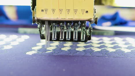 Close-up-of-modern-sewing-machine-doing-stitching-model-on-fabric