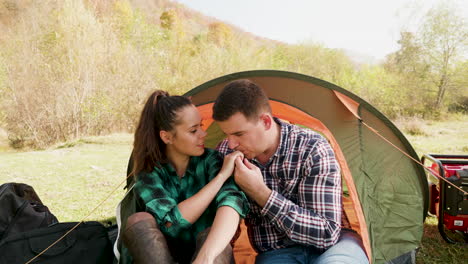 Caucasian-young-couple-camping-near-the-mountains