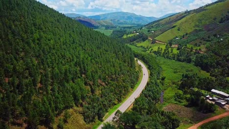 Scenic-Drive-On-Mountain-Road-With-Dense-Green-Forest-In-Uganda