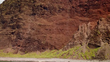 Gimbal-close-up-POV-shot-from-a-moving-boat-of-the-rugged-shoreline-and-rocky-cliffs-along-the-southern-edge-of-the-Na-Pali-Coast-on-the-island-of-Kaua'i,-Hawai'i