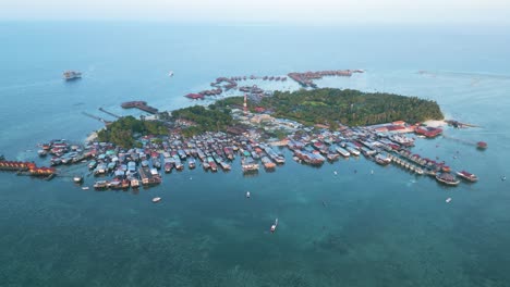 High-orbiting-shot-of-the-whole-Mabul-Island-housing-the-Bajau-Laut-community