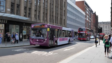 Alexander-Dennis-Enviro-300-bus-of-First-transportational-company-in-the-streets-of-Glasgow-turning-right