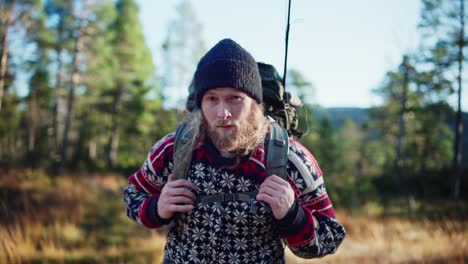 Bearded-Norwegian-Guy-With-Backpack-In-Forest-Mountain-During-Summer