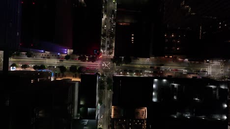 Aerial-view-of-Road-intersection-with-street-lights-and-moving-cars-in-American-city-at-night,-Downtown-Atlanta,-Georgia,-USA