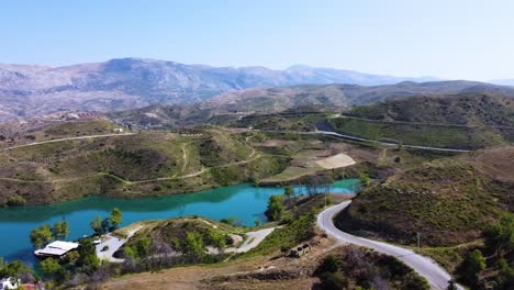 Pan-over-Oymapinar-dam-and-mountain-roads-on-a-sunny-day,-Manavgat-Turkey