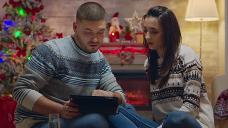 Caucasian-couple-doing-online-shopping-on-tablet-computer