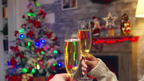 Young-woman-holding-sparkling-champagne-celebrating-christmas