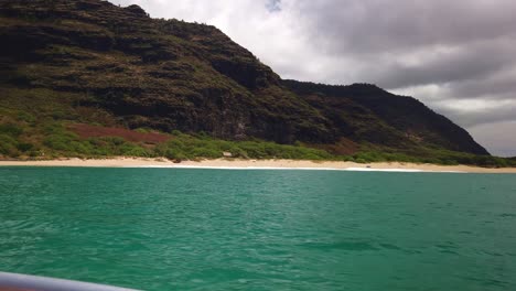 Gimbal-wide-panning-shot-from-a-boat-along-the-rugged-southern-Na-Pali-coastline-near-Polihale-Beach-on-the-Hawaiian-island-of-Kaua'i