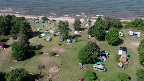Happy-holiday-way-by-Baltic-people-near-Baltic-sea-in-Latvia-aerial-video