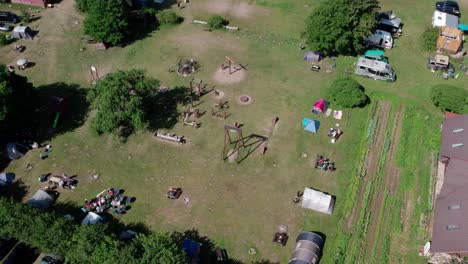 aerial-view-in-campsite-neat-to-Baltic-sea-in-Latvia,-where-people-spend-their-weekends-by-relaxing