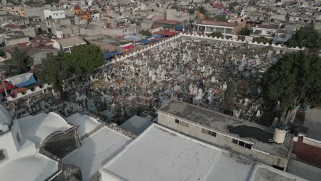 Flyover-St-Andrews-church-to-graveyard-cemetery-in-Mixquic,-Mexico
