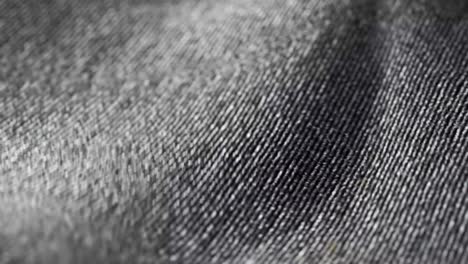 Highly-detailed-grey-cloth-fabric-fluttering-on-the-wind.-Textile-surface-with-fiber-pattern-visible-in-close-up-camera.-Natural,-smooth-drapery-movement.-Endless,-seamless,-loopable-animation.