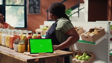 Tablet-display-showing-greenscreen-in-local-organic-shop